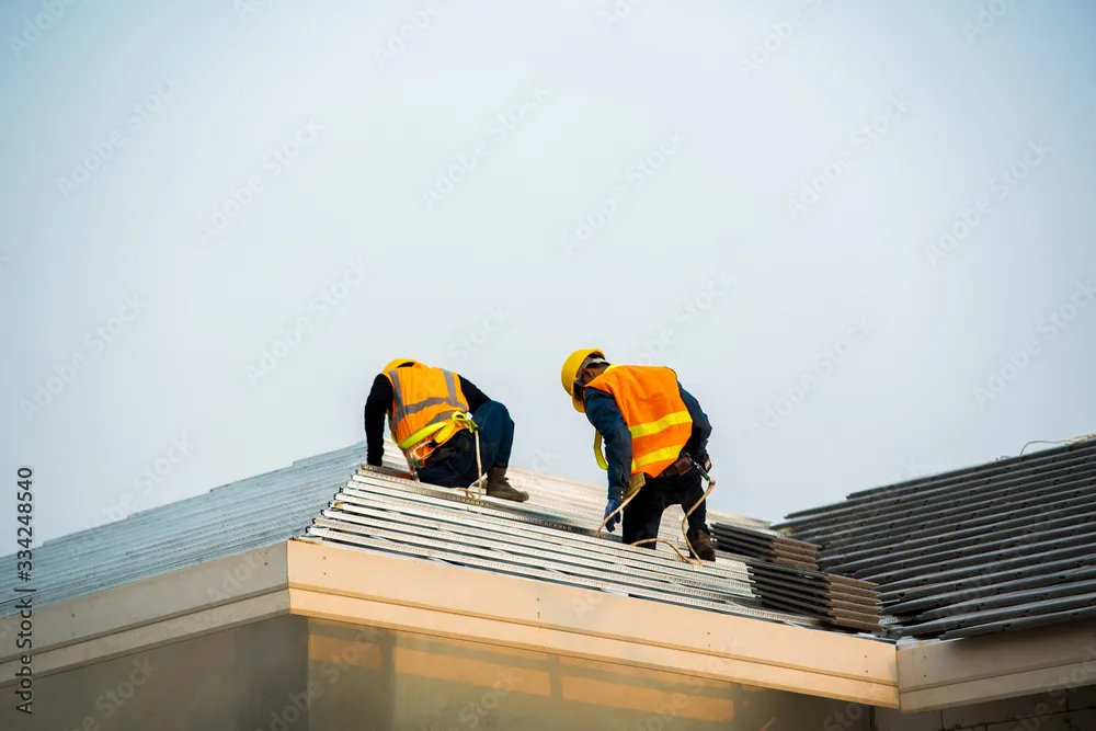Experienced TruePro roofers completing a residential project